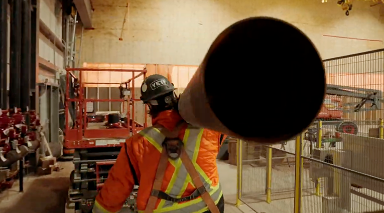 Western Fire Team Carrying Large PIpe